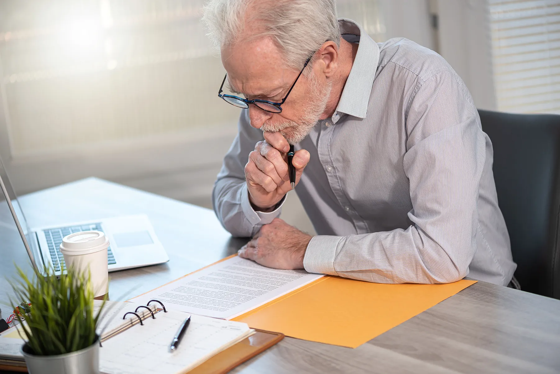 man looking over paperwork